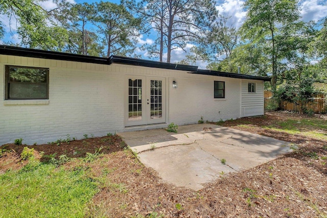 2309 Oxford Rd, Tallahassee, FL 32304 - back of property with brick siding, french doors, and a patio area
