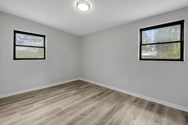 2309 Oxford Rd, Tallahassee, FL 32304 - empty room with light wood finished floors and baseboards