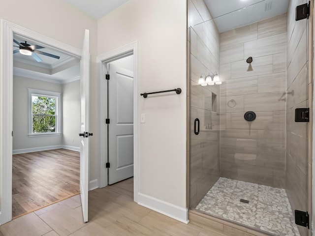 bathroom with ceiling fan, wood-type flooring, and walk in shower