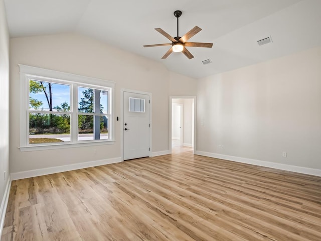 interior space featuring ceiling fan, light hardwood / wood-style floors, and lofted ceiling