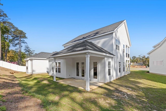 back of house featuring french doors, a yard, and a patio