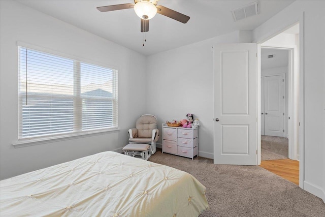 bedroom with light colored carpet and ceiling fan