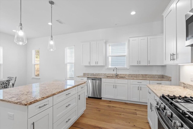 kitchen featuring white cabinetry, appliances with stainless steel finishes, and sink