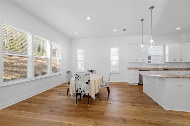 dining room with light hardwood / wood-style flooring