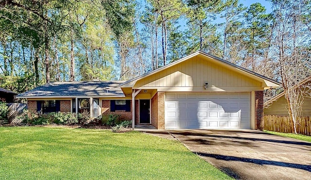 ranch-style home featuring a front lawn and a garage