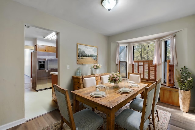 dining room with light hardwood / wood-style flooring