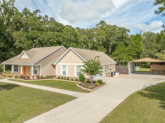 view of front of house with a front yard, a carport, and a garage