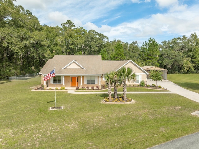 view of front of property featuring a garage and a front yard