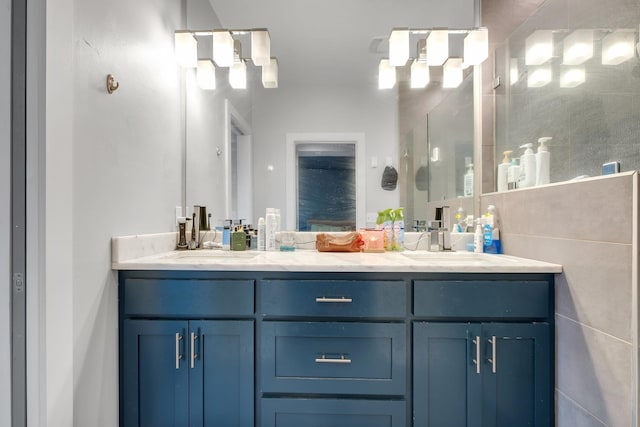 1256 N Bronough St, Tallahassee, FL 32303 - full bathroom featuring double vanity, a shower with shower door, and a chandelier