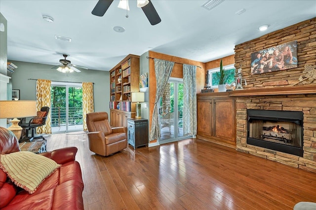 3508 Trillium Ct, Tallahassee, FL 32312 - living room with ceiling fan, a fireplace, and hardwood / wood-style floors