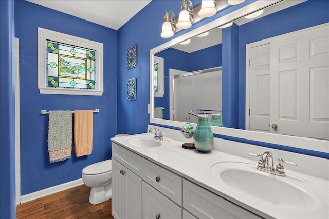 3508 Trillium Ct, Tallahassee, FL 32312 - full bath with a stall shower, wood finished floors, and double vanity