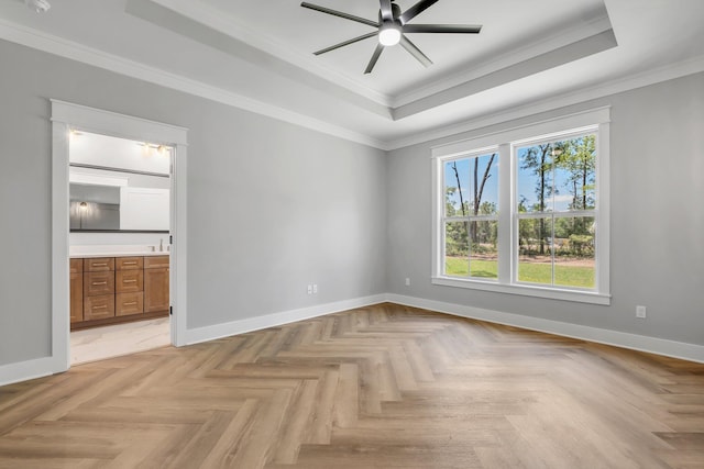 205 Fairway Dr, Havana, FL 32333 - empty room featuring a raised ceiling, a ceiling fan, crown molding, and baseboards