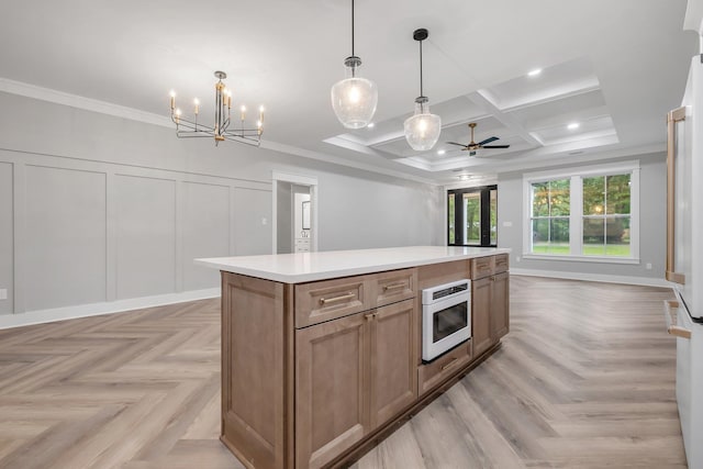 205 Fairway Dr, Havana, FL 32333 - kitchen with a kitchen island, open floor plan, ornamental molding, coffered ceiling, and a ceiling fan