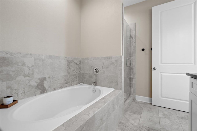 5735 Pinebarren Rd, Tallahassee, FL 32303 - bathroom featuring a bath, baseboards, vanity, and a stall shower
