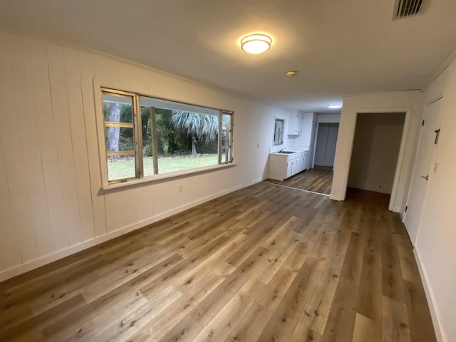 interior space featuring hardwood / wood-style flooring and sink