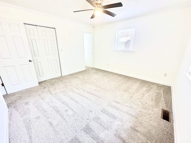 24118 Lone Star Rd, Tallahassee, FL 32310 - unfurnished bedroom featuring a ceiling fan, a closet, ornamental molding, carpet flooring, and visible vents