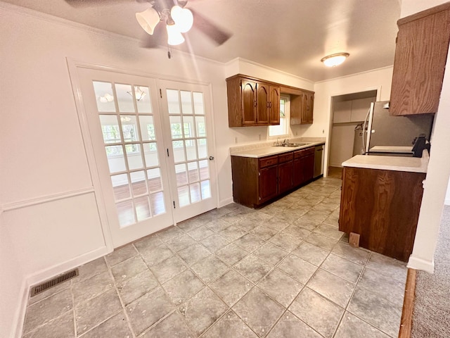 24118 Lone Star Rd, Tallahassee, FL 32310 - kitchen with a sink, visible vents, a ceiling fan, dishwashing machine, and light countertops