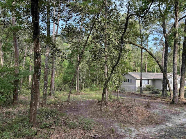 24118 Lone Star Rd, Tallahassee, FL 32310 - view of yard featuring a view of trees and fence