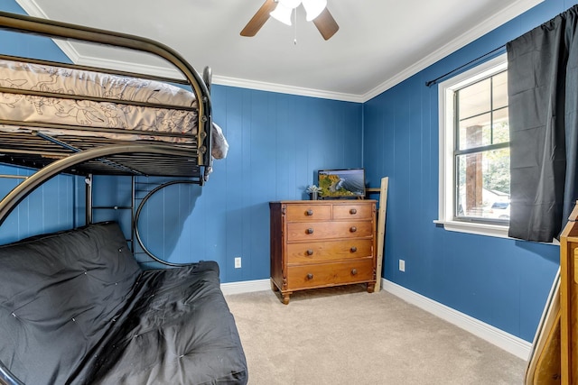 bedroom featuring light colored carpet, ceiling fan, and crown molding