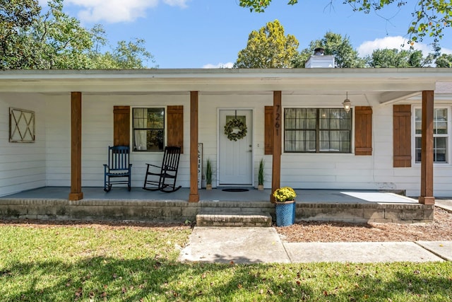 doorway to property with a porch