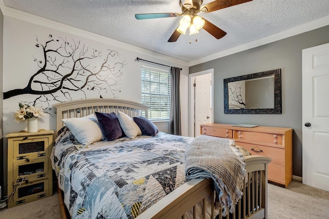 carpeted bedroom with ceiling fan, crown molding, and a textured ceiling