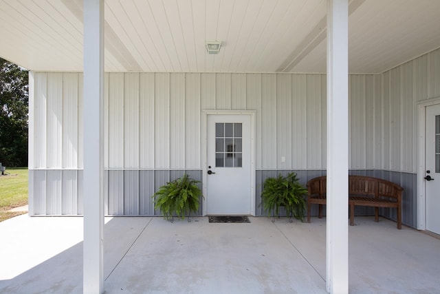 property entrance featuring a patio area