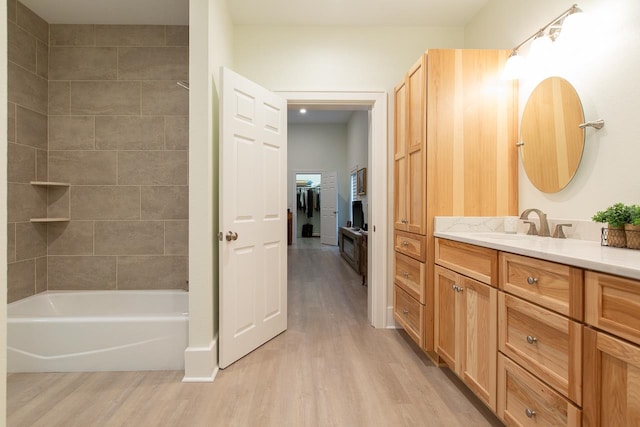 bathroom with vanity and hardwood / wood-style flooring