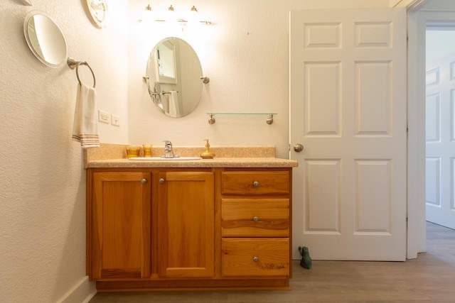 bathroom featuring hardwood / wood-style floors and vanity