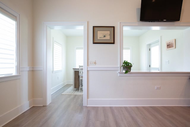 interior space featuring a healthy amount of sunlight and light hardwood / wood-style flooring