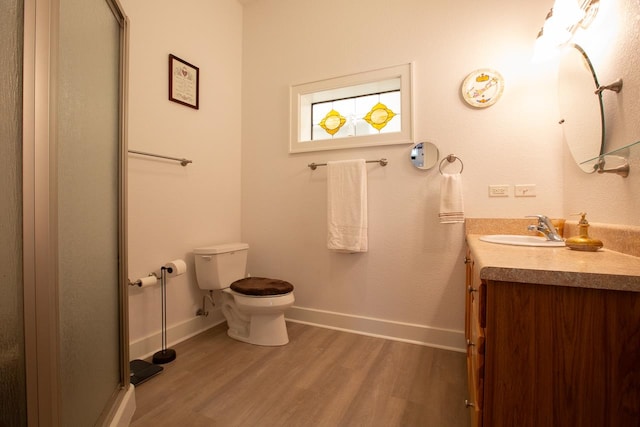 bathroom featuring hardwood / wood-style floors, vanity, and toilet