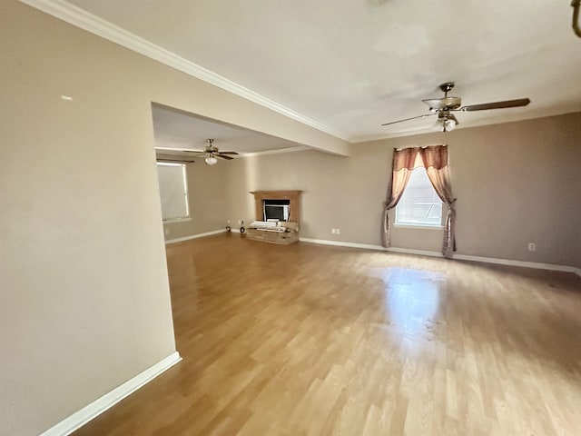 508 NE 3rd St, Havana, FL 32333 - unfurnished living room featuring ceiling fan, a fireplace, baseboards, wood finished floors, and ornamental molding