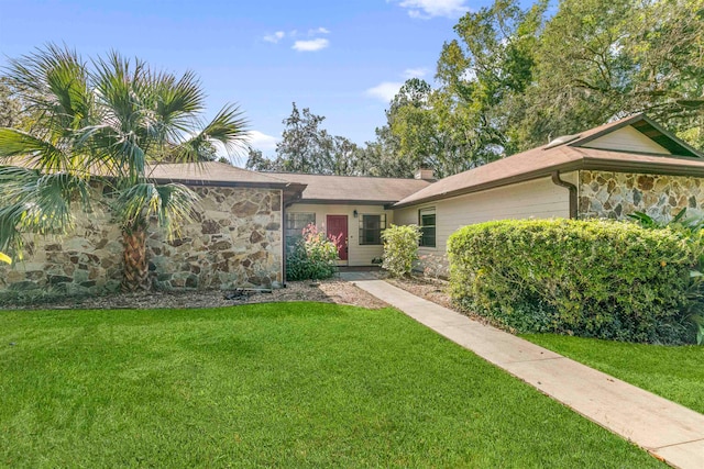 single story home with a front yard