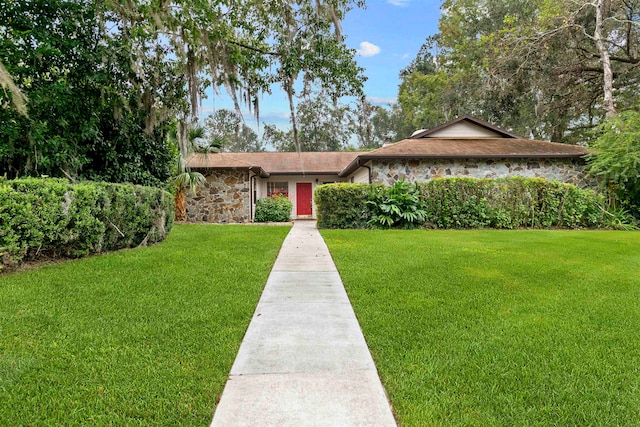 ranch-style house with a front lawn