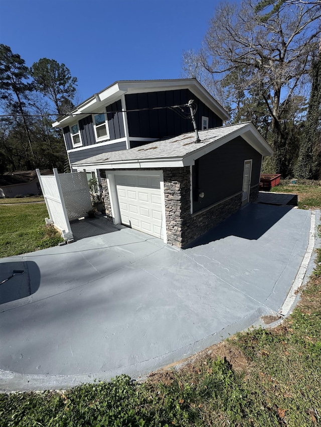 view of side of property with a garage