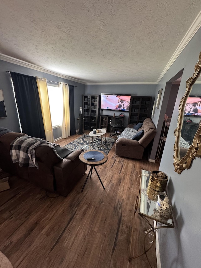 living room featuring hardwood / wood-style flooring, crown molding, and a textured ceiling