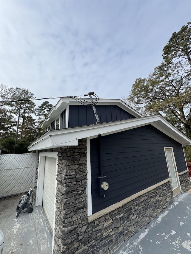 view of side of property featuring a garage