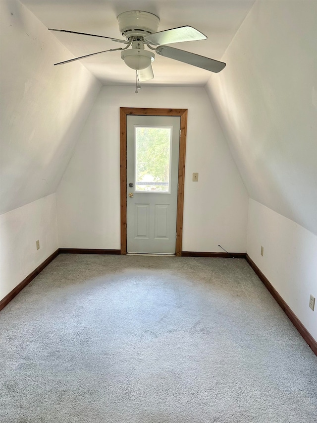 additional living space with vaulted ceiling, ceiling fan, and carpet floors