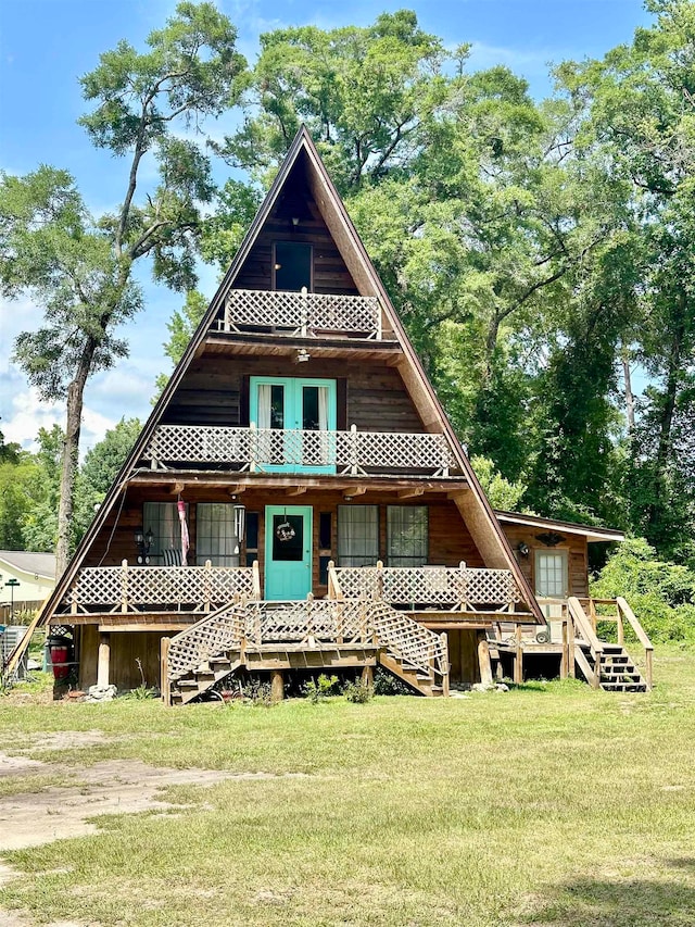 rear view of house with a yard