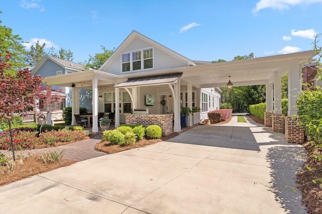 1216 Mitchell Ave, Tallahassee, FL 32303 - exterior space with a standing seam roof, metal roof, covered porch, and concrete driveway