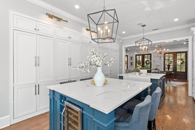 1216 Mitchell Ave, Tallahassee, FL 32303 - interior space featuring recessed lighting, light wood finished floors, a notable chandelier, and wine cooler