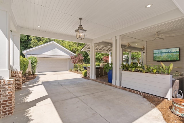 1216 Mitchell Ave, Tallahassee, FL 32303 - view of patio / terrace with ceiling fan, an outbuilding, and a detached garage