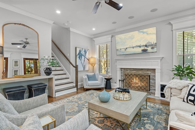 1216 Mitchell Ave, Tallahassee, FL 32303 - living room featuring a tile fireplace, baseboards, a ceiling fan, and wood finished floors