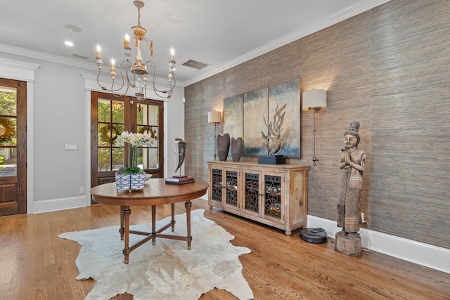 1216 Mitchell Ave, Tallahassee, FL 32303 - office with wood finished floors, visible vents, an inviting chandelier, and ornamental molding