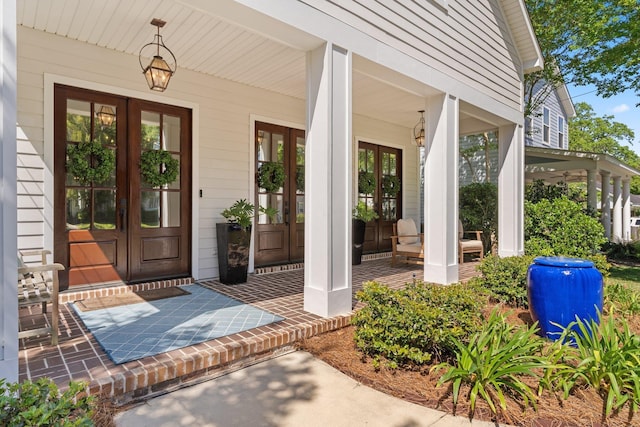 1216 Mitchell Ave, Tallahassee, FL 32303 - view of exterior entry with covered porch and french doors