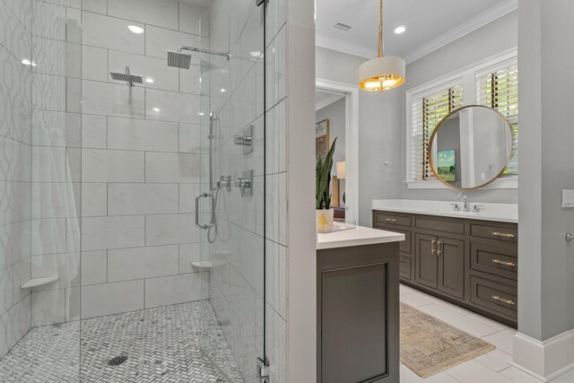 1216 Mitchell Ave, Tallahassee, FL 32303 - full bathroom featuring a shower stall, crown molding, vanity, tile patterned flooring, and visible vents