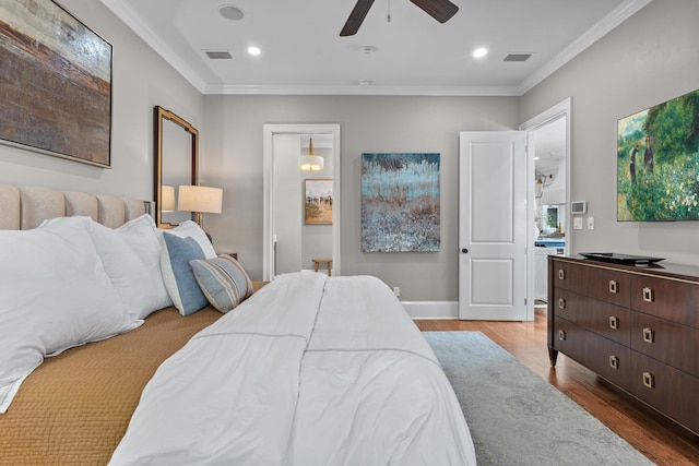 1216 Mitchell Ave, Tallahassee, FL 32303 - bedroom featuring wood finished floors, visible vents, crown molding, and a ceiling fan