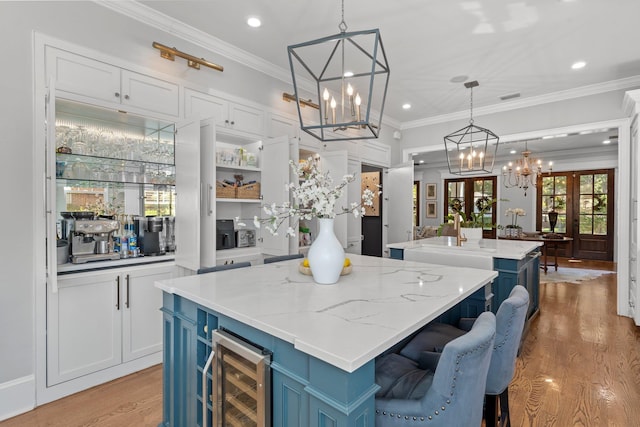 1216 Mitchell Ave, Tallahassee, FL 32303 - interior space featuring recessed lighting, light wood-style floors, an inviting chandelier, and wine cooler
