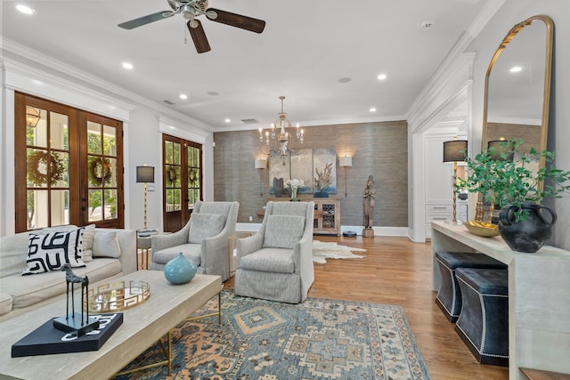 1216 Mitchell Ave, Tallahassee, FL 32303 - living room featuring ceiling fan with notable chandelier, french doors, wood finished floors, and recessed lighting