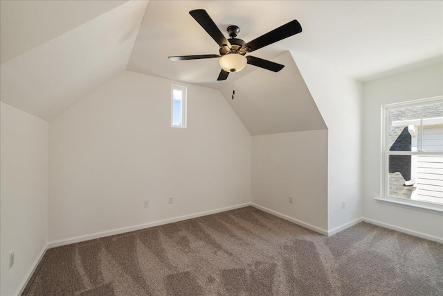 bonus room with ceiling fan, lofted ceiling, and light carpet