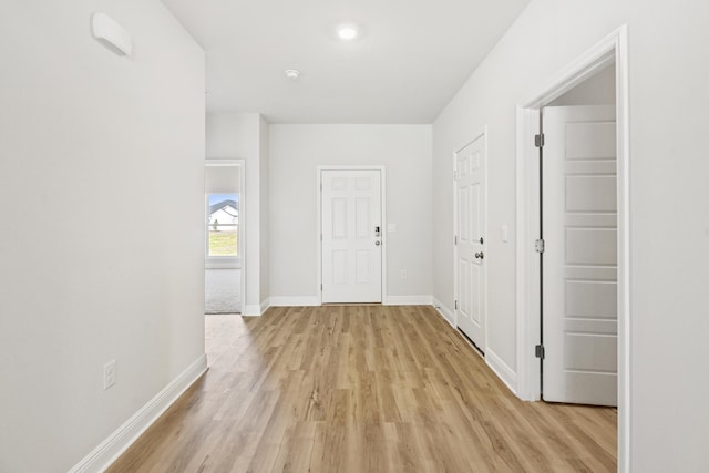 hall with light hardwood / wood-style flooring